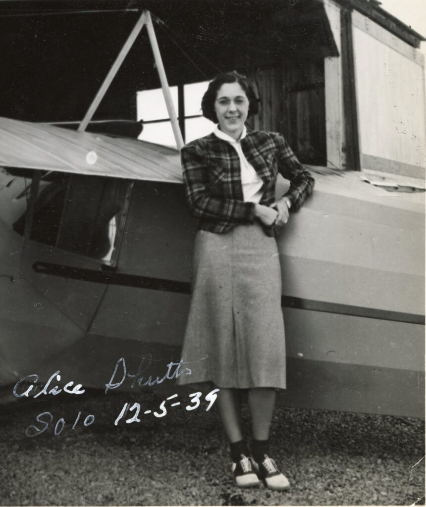 Alice Fuchs (then Shutts) posed next to an airplane after a solo flight at the State College Airport Depot. (Centre