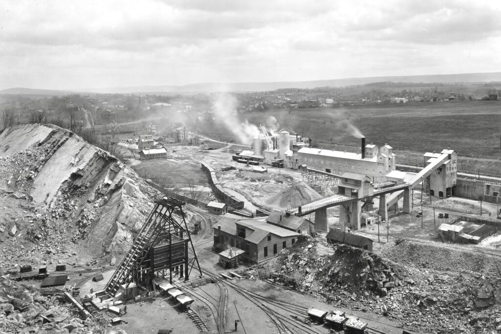 This 1920s view shows an opening to Warner Co.’s Bell Mine at lower left, from which limestone was brought up in tram
