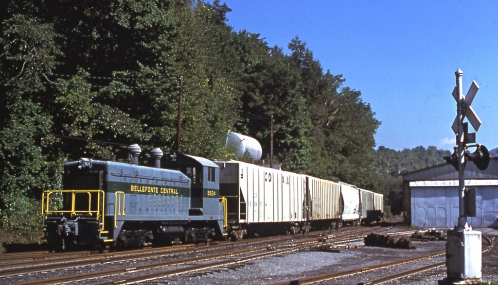 A Bellefonte Central diesel locomotive pushed cars loaded with lime past the Coleville enginehouse. (Michael Bezilla