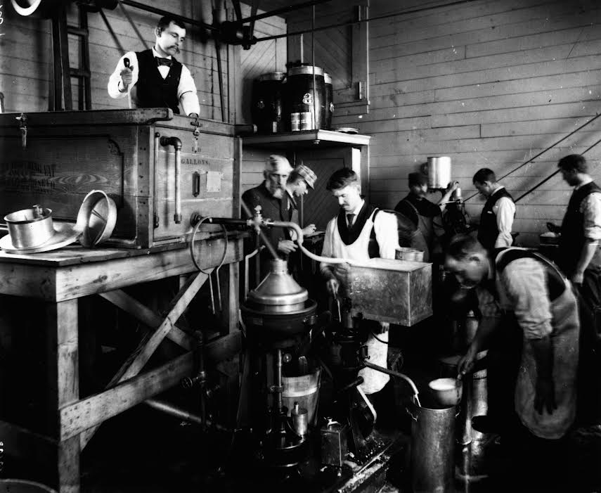 Dairy Short Course students in 1894 churned butter. (Penn State Archives)