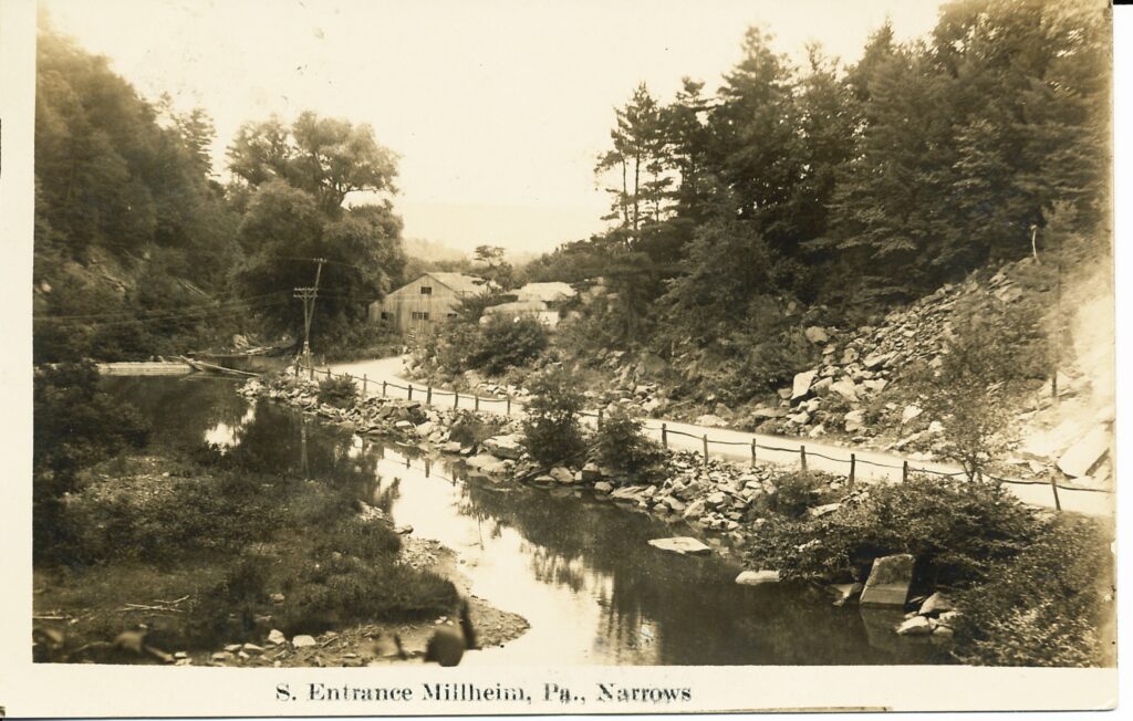 An early 20th century postcard shows the south entrance to Millheim along Elk Creek. (Centre County Historical Society)