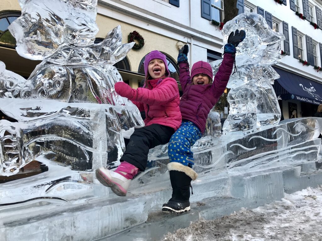 Children played on a ice sculpture at First Night State College in 2018.