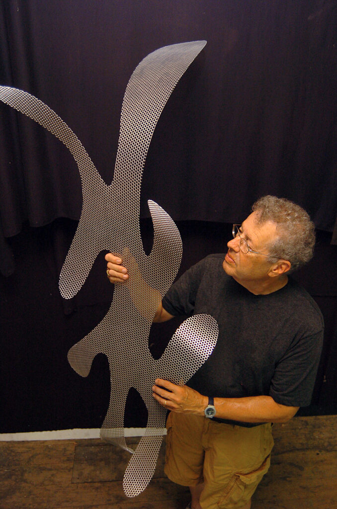Rob Fisher with "Seaform," a prototype of a 32-piece work in Hong Kong. (Photograph by Patrick Waksmunski)