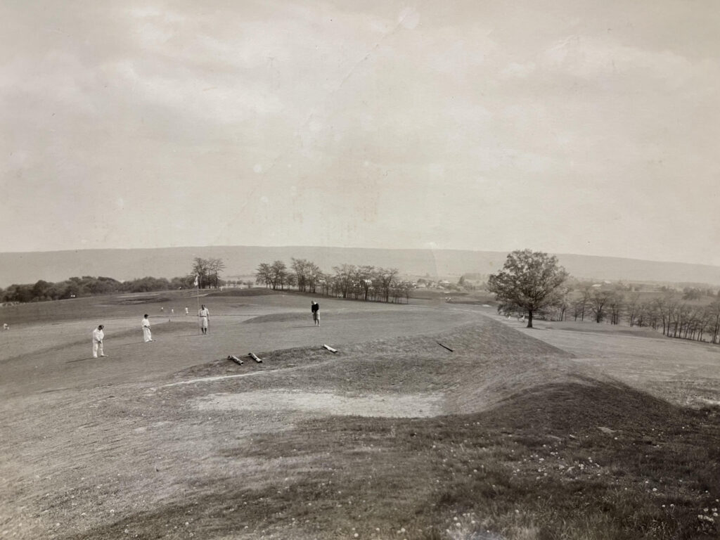 Golfers play a hole on the Campus Course in 1928. It is now the 13th hole on the White Course. (Penn State Special