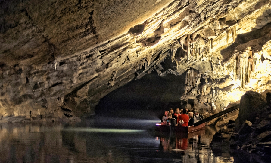 Visitors tour the water-filled Penn's Cave by flat-bottomed boats. (Photograph courtesy of Happy Valley Adventure