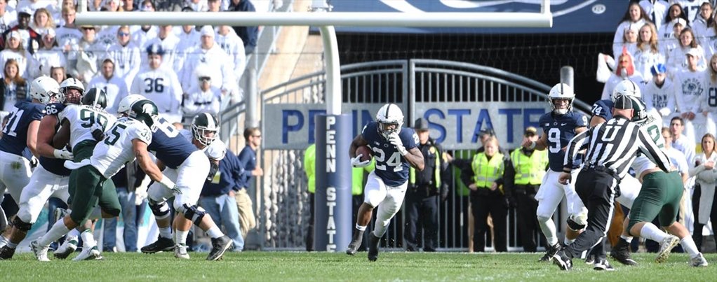 Running back Miles Sanders found a hole to run through during a game against Michigan State. (Photograph by Steve
