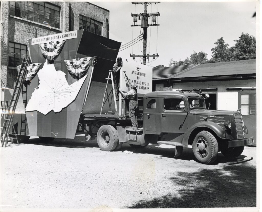 Workers prepared a parade float celebrating the thirty-fifth anniversary of Titan Metal. (Centre County Historical